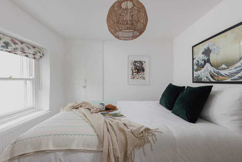 Muted calming tones help you drift off to sleep in this gorgeous bedroom.