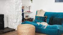 This stylish low slung sofa creates a lovely chill-out nook don't worry the other large velvet sofa is a normal height.