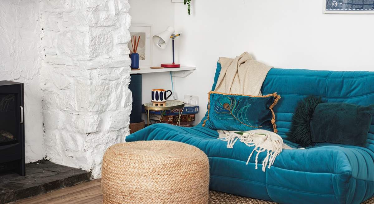 This stylish low slung sofa creates a lovely chill-out nook don't worry the other large velvet sofa is a normal height.