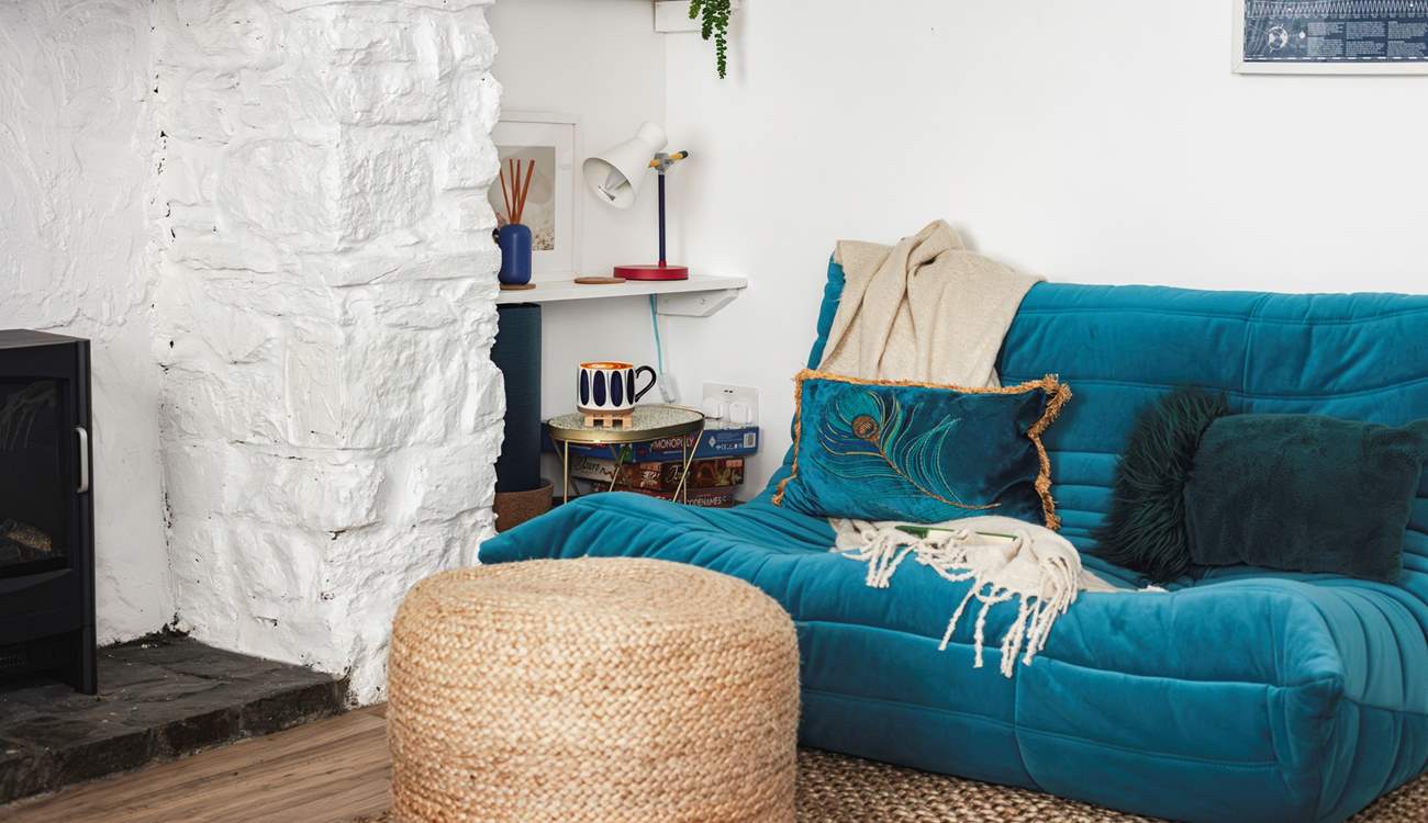 This stylish low slung sofa creates a lovely chill-out nook don't worry the other large velvet sofa is a normal height.