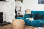 This stylish low slung sofa creates a lovely chill-out nook don't worry the other large velvet sofa is a normal height.