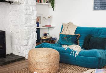 This stylish low slung sofa creates a lovely chill-out nook don't worry the other large velvet sofa is a normal height.
