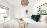 Muted calming tones help you drift off to sleep in this gorgeous bedroom. - Thumbnail Image