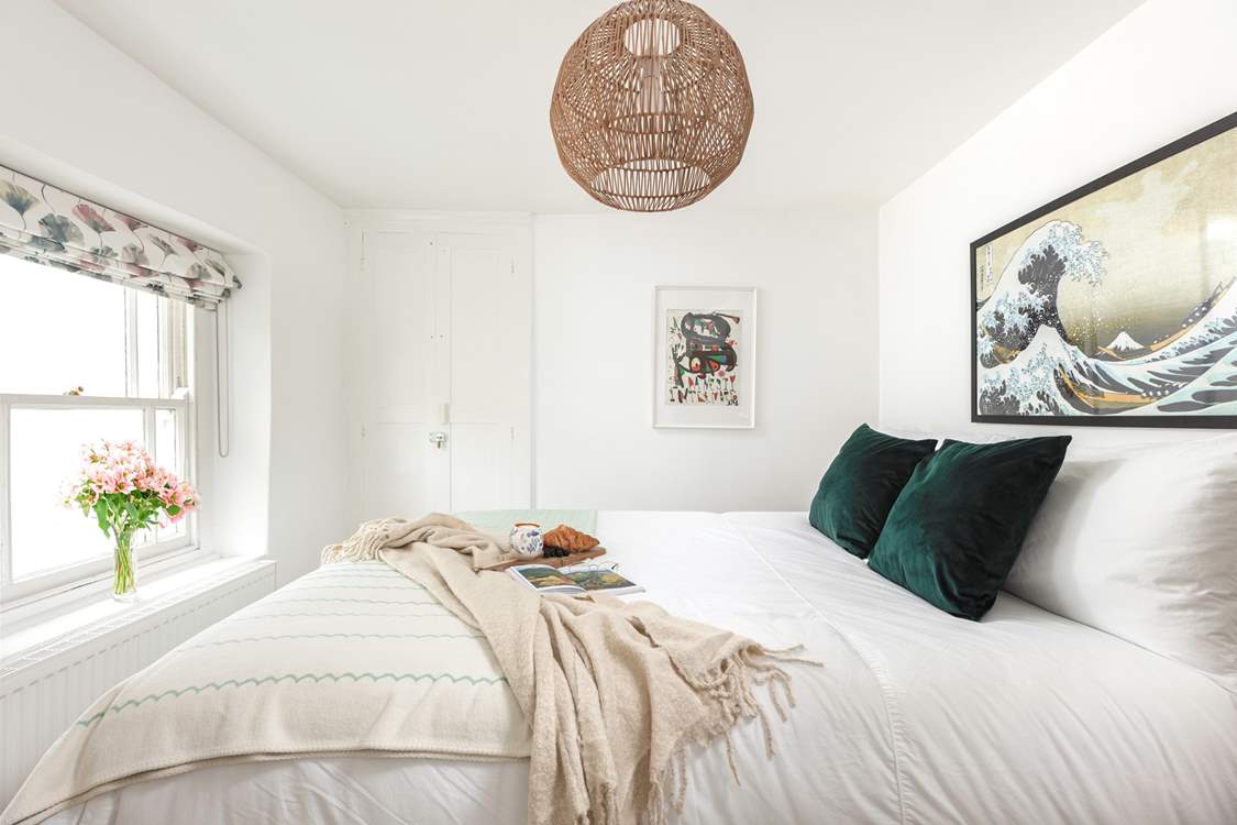 Muted calming tones help you drift off to sleep in this gorgeous bedroom.
