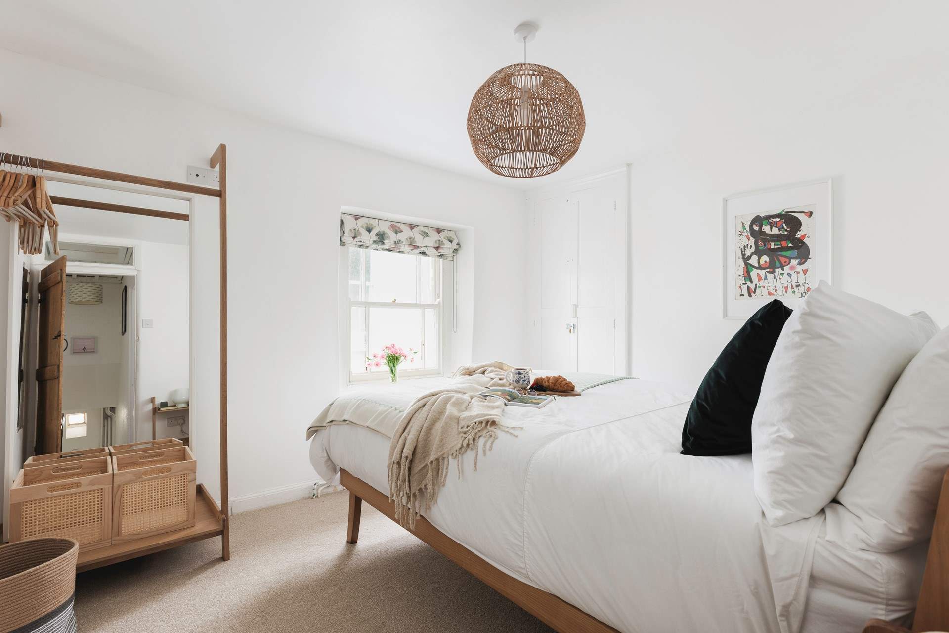 Muted tones and a cosy bed cam be found in bedroom one.