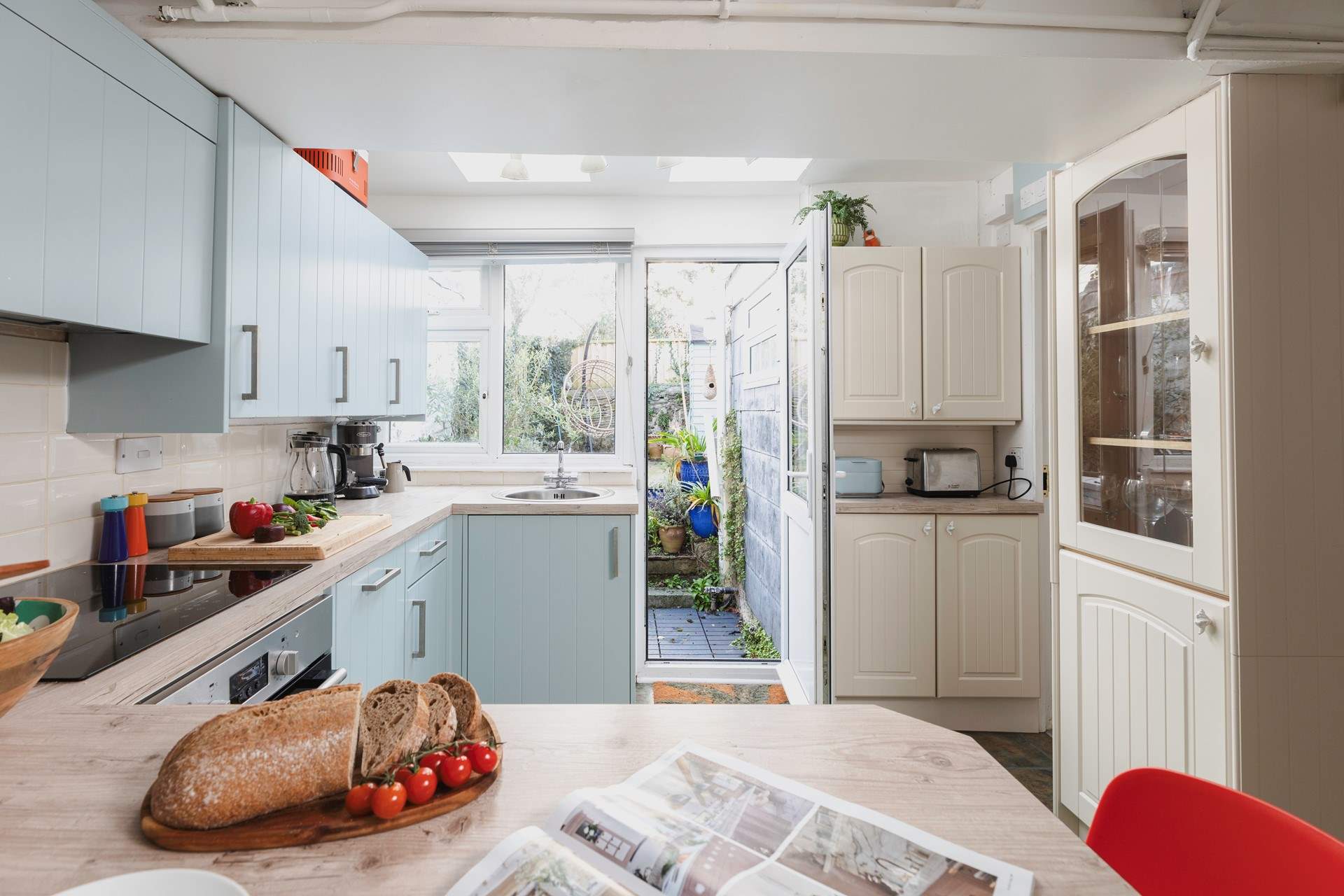From the kitchen you can access the garden as well as the downstairs bathroom.