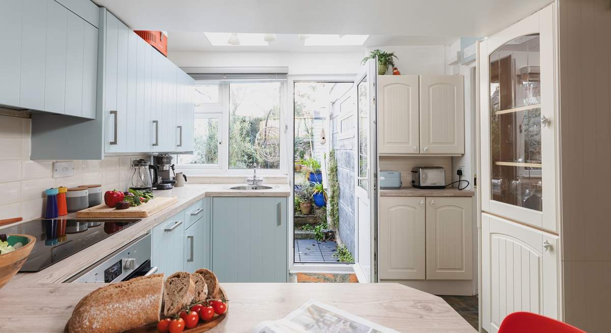 From the kitchen you can access the garden as well as the downstairs bathroom.