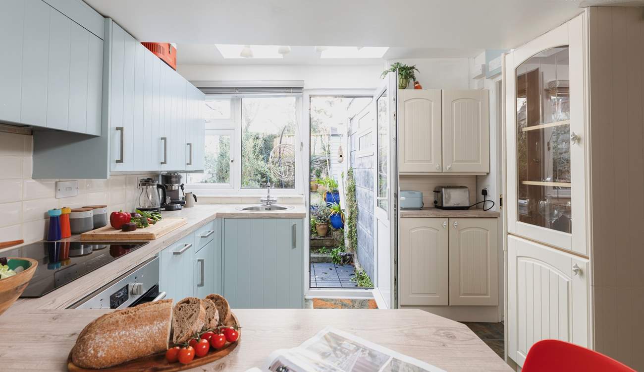 From the kitchen you can access the garden as well as the downstairs bathroom.