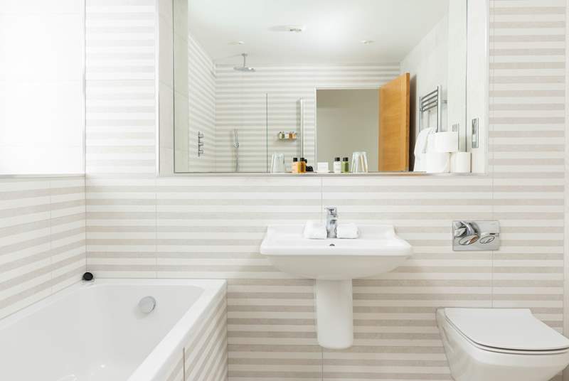Whether it's a soak in the bath or a refreshing shower, the stylish bathroom has it covered!