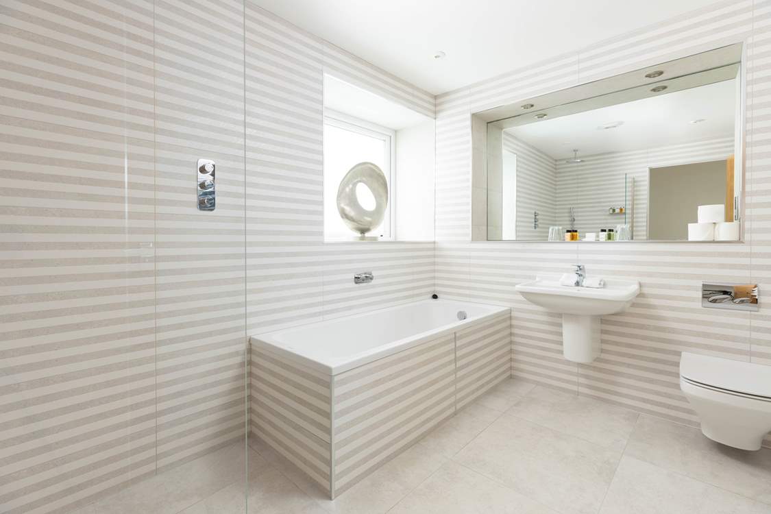 The bathroom is just across the hall from bedroom 1.