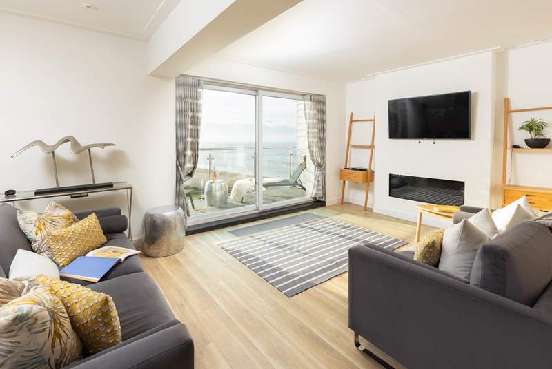 The open plan living-room has a fabulous view of the sea.