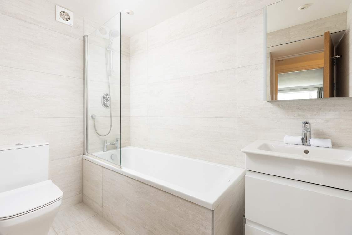 This stylish and sleek bathroom allows you to indulge in a long relaxing bath!