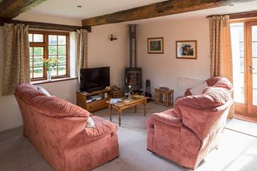 The warming wood-burner is a lovely feature in the sitting/dining-room - ideal after a long walk on the moors.