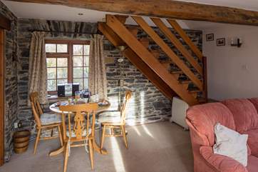 The open plan sitting/dining-room which leads through from the kitchen.