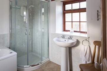 Downstairs, the bathroom is located to the left of the property on the ground floor.