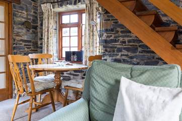 The open plan sitting/dining-room which leads through from the kitchen.