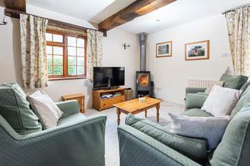 The warming wood-burner is a lovely feature in the sitting/dining-room - ideal after a long walk on the moors.