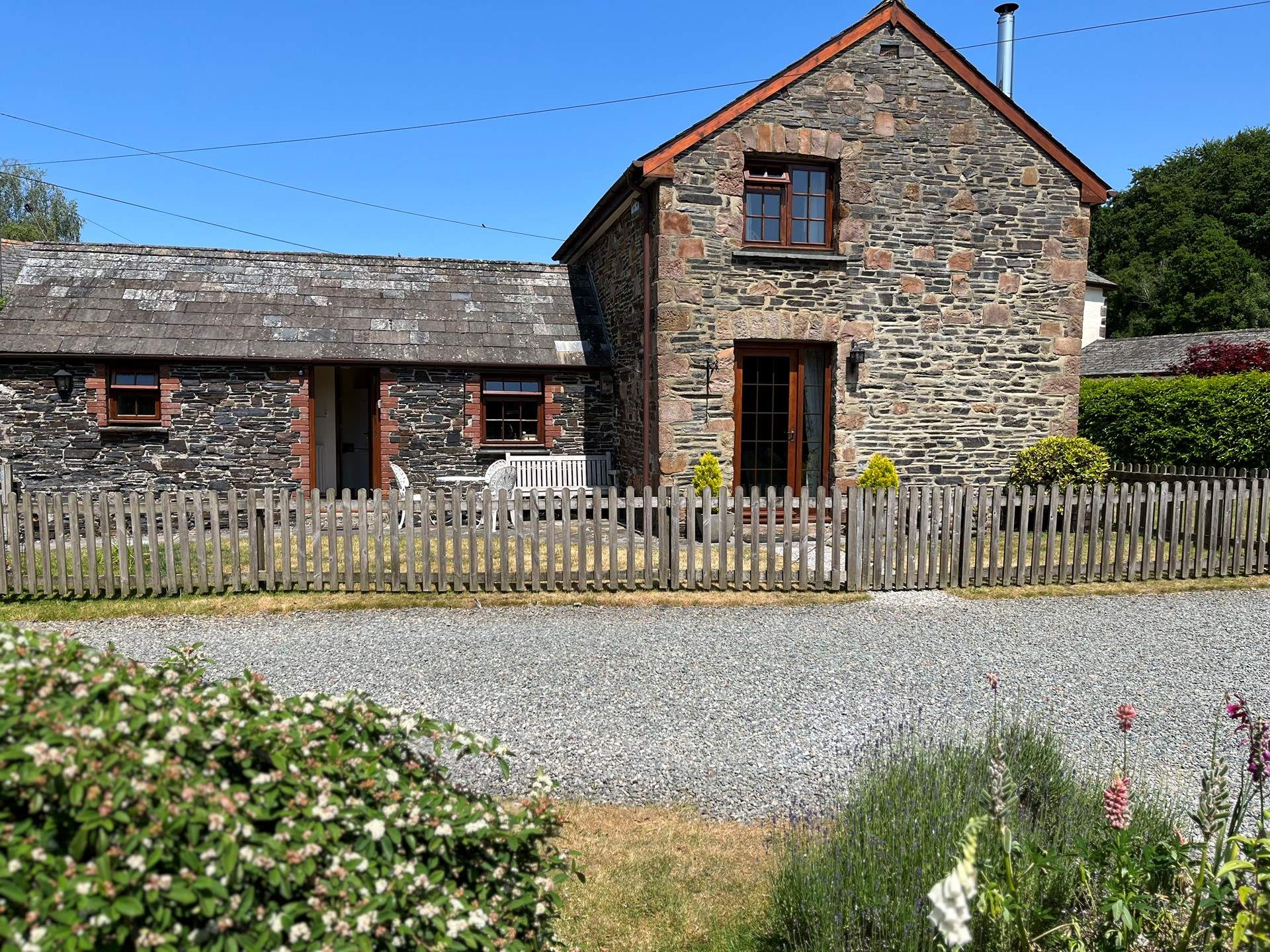 The garden is fully enclosed with a handy door off of the sitting-room to the grassed garden.
