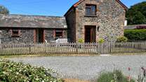The garden is fully enclosed with a handy door off the sitting-room to the grassed garden.