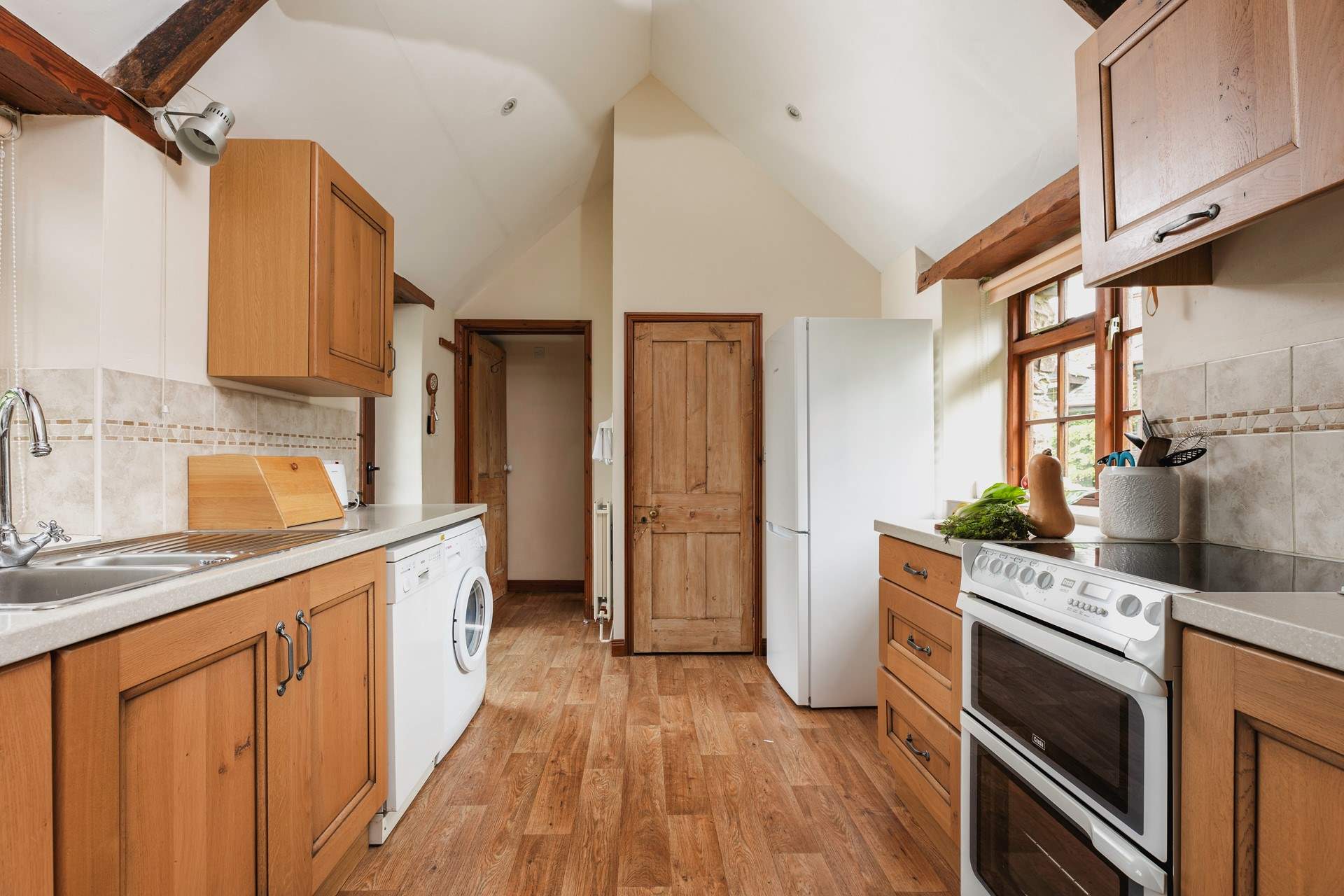 Walk through the kitchen and on to the bathroom.