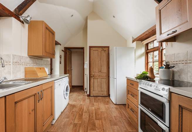 Walk through the kitchen on on to the bathroom.