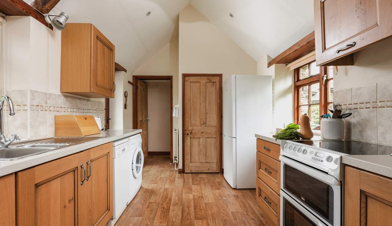 Walk through the kitchen and on to the bathroom.