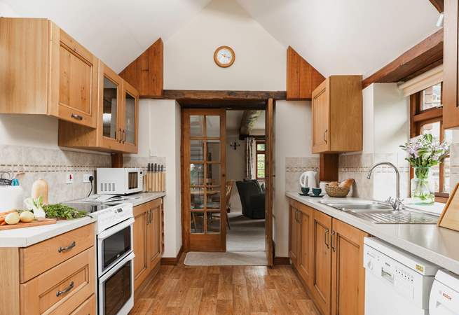 The kitchen leads into the sitting room.
