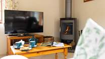 The warming wood-burner is a lovely feature in the sitting/dining-room - ideal after a long walk on the moors.