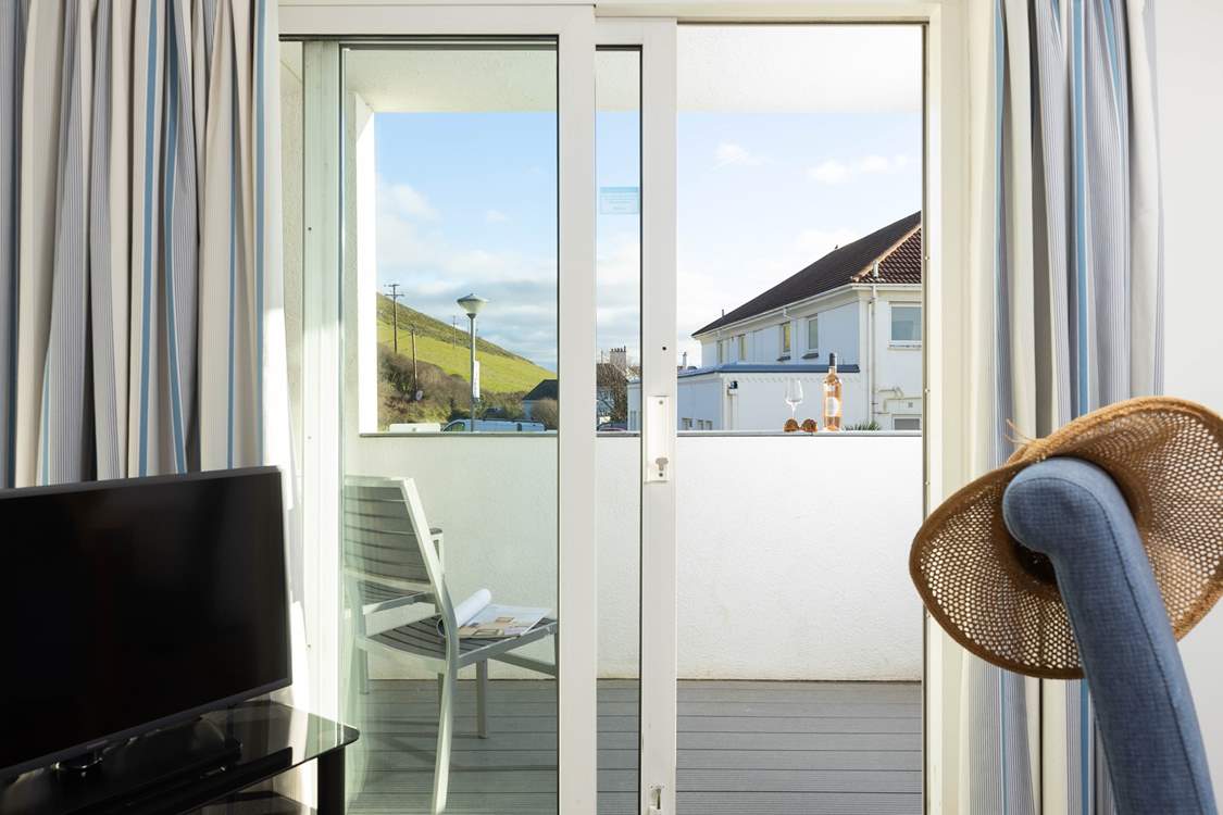 Slide back the patio doors and step out on to your balcony.