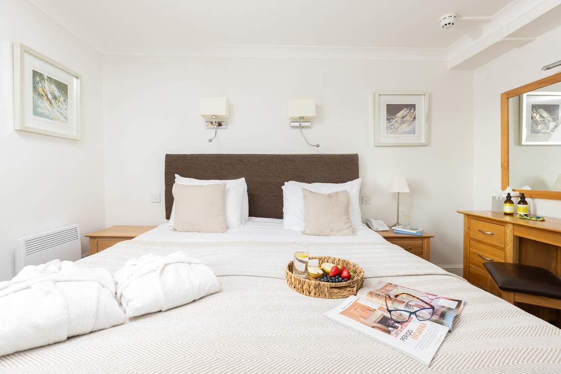 Bedroom 1 has a king-size double bed and en suite shower-room.