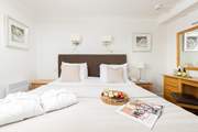 Bedroom 1 has a king-size double bed and en suite shower-room.