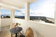 Why not enjoy a botte of fizz on the spacious corner balcony.