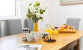 Sit around the dining-table and talk through the plan for the day. - Thumbnail Image