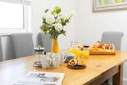 Sit around the dining-table and talk through the plan for the day.
