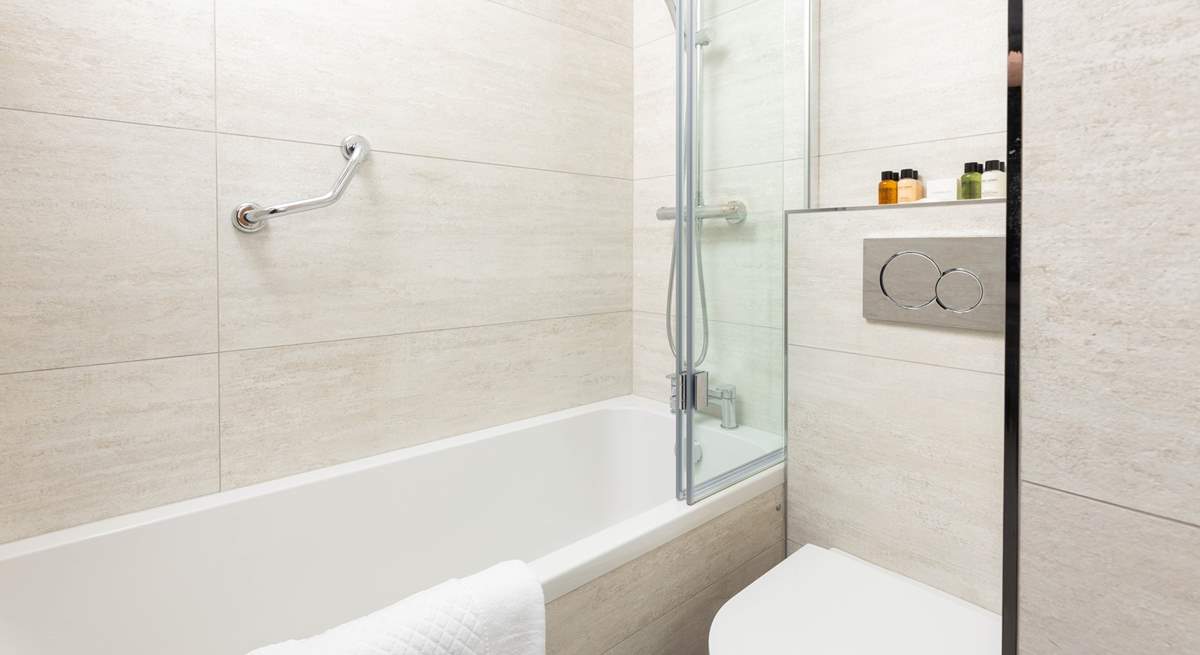 This stylish and contemporary bathroom sits on the corridor between the bedrooms.