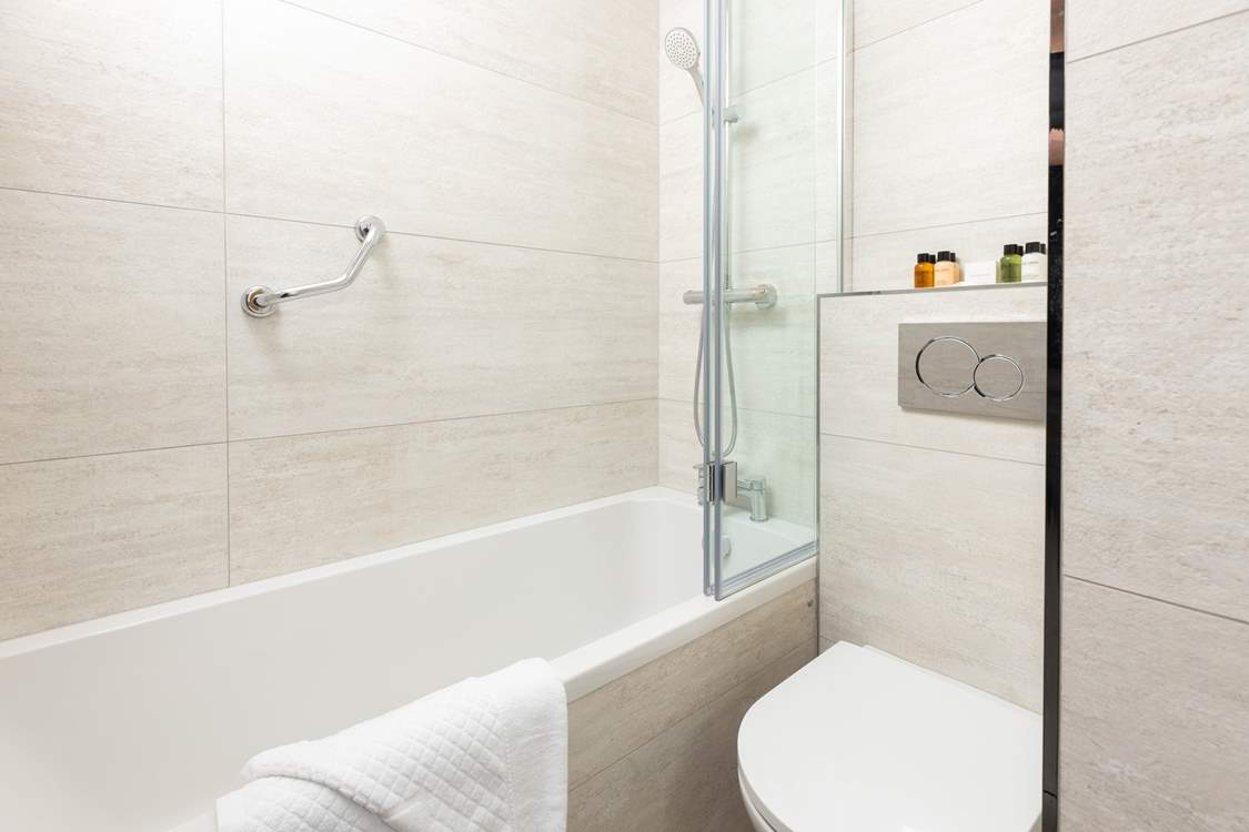 This stylish and contemporary bathroom sits on the corridor between the bedrooms.