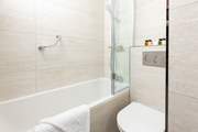 This stylish and contemporary bathroom sits on the corridor between the bedrooms.
