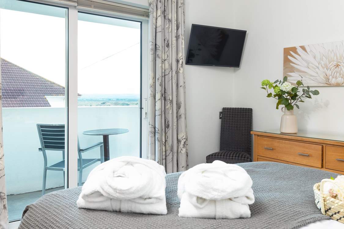 Wake up and step out onto the balcony to take in the view of the sand dunes.