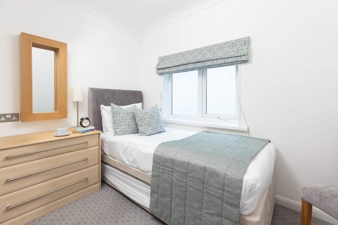 A small but perfectly formed bedroom with the option of a truckle bed.