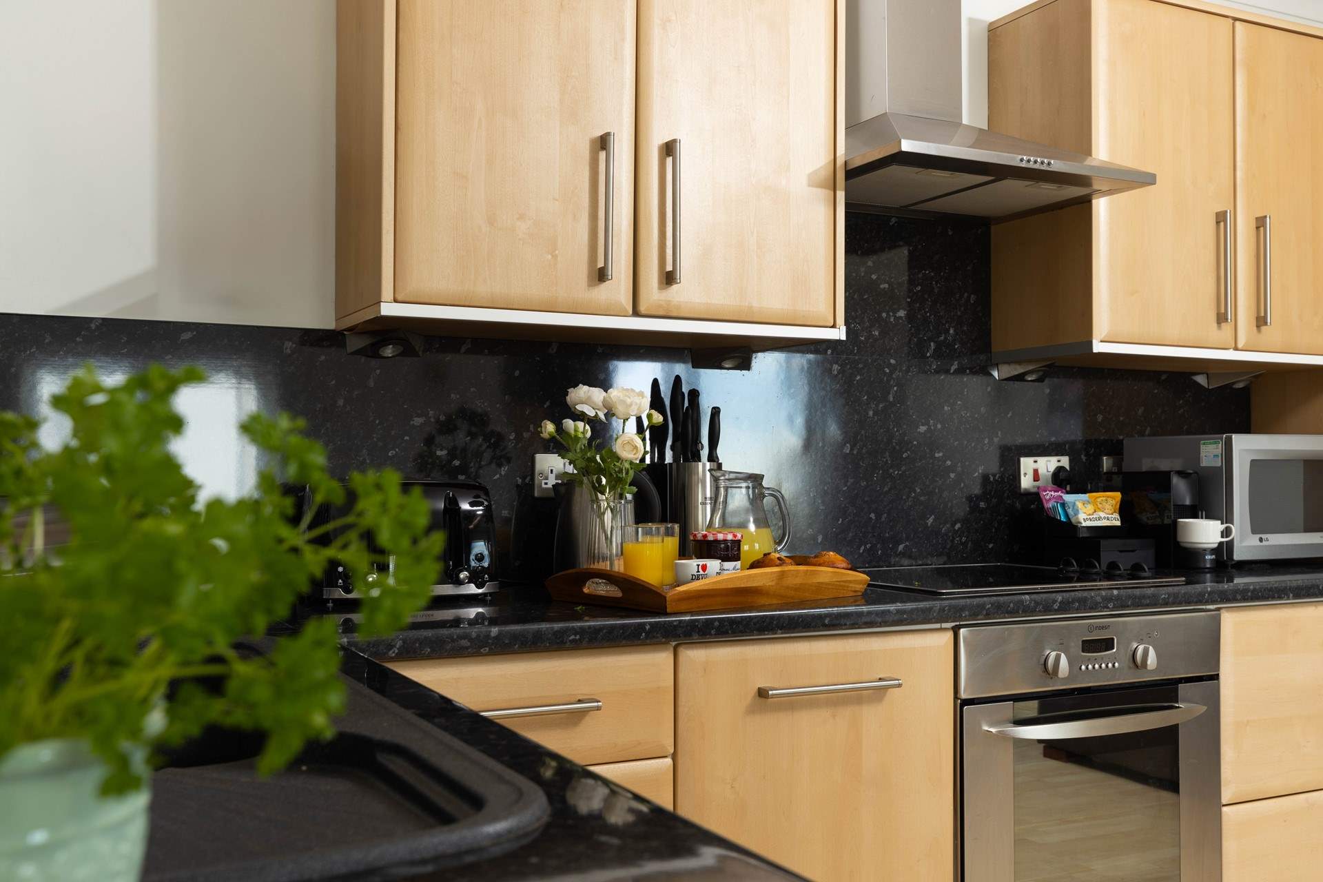 A fully equipped kitchen awaits along with a Nespresso coffee machine. 