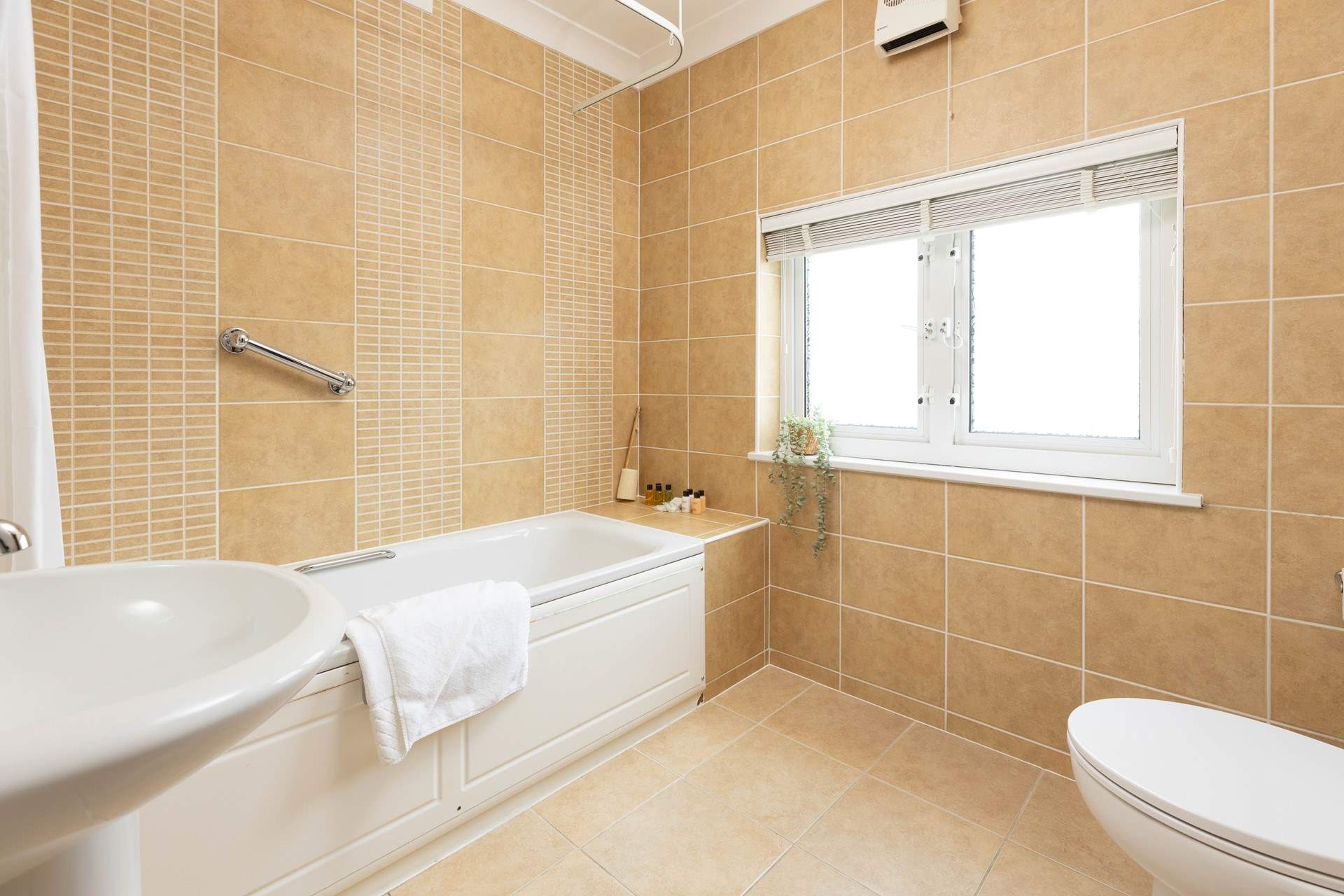 This large family bathroom is shared by both bedrooms.  