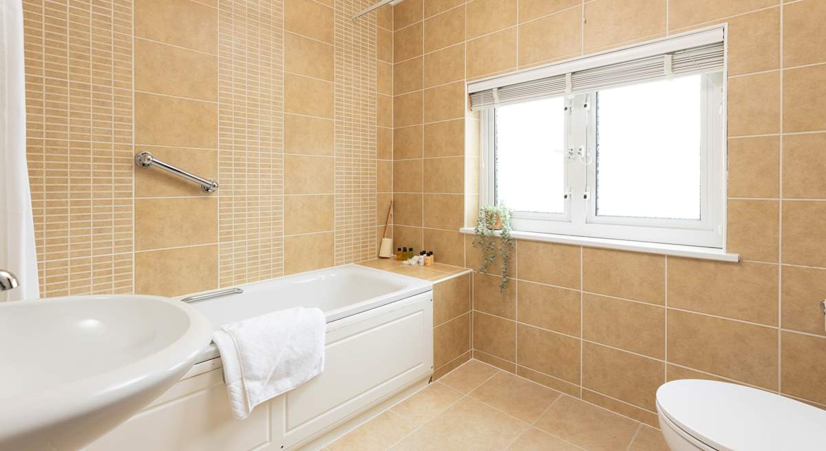 This large family bathroom is shared by both bedrooms.  