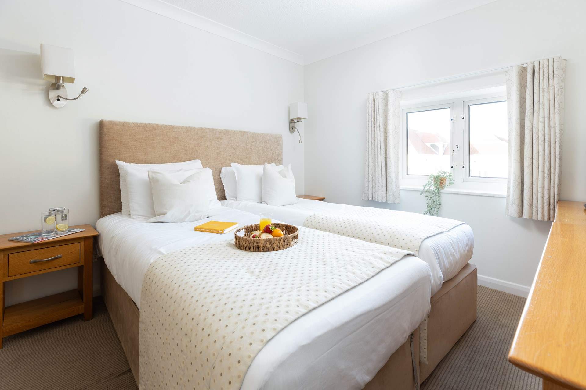 The bedrooms are spacious and bright.