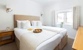 The bedrooms are spacious and bright. - Thumbnail Image
