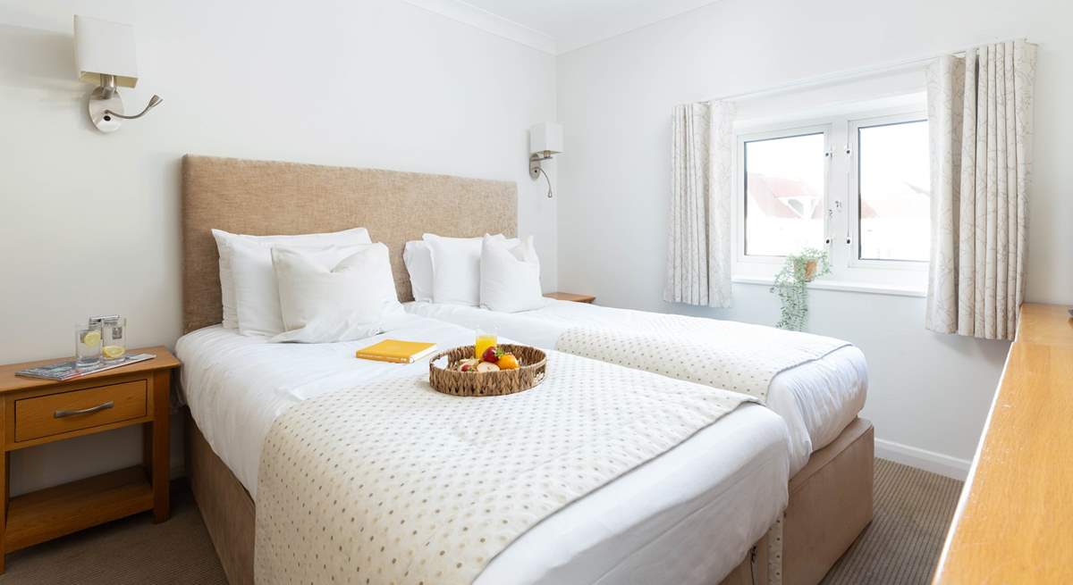The bedrooms are spacious and bright.