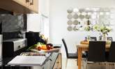 The open plan area provides a sociable space for cooking and dining together. - Thumbnail Image