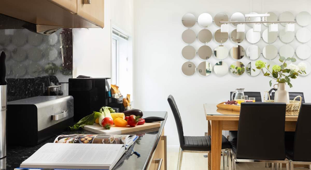 The open plan area provides a sociable space for cooking and dining together.