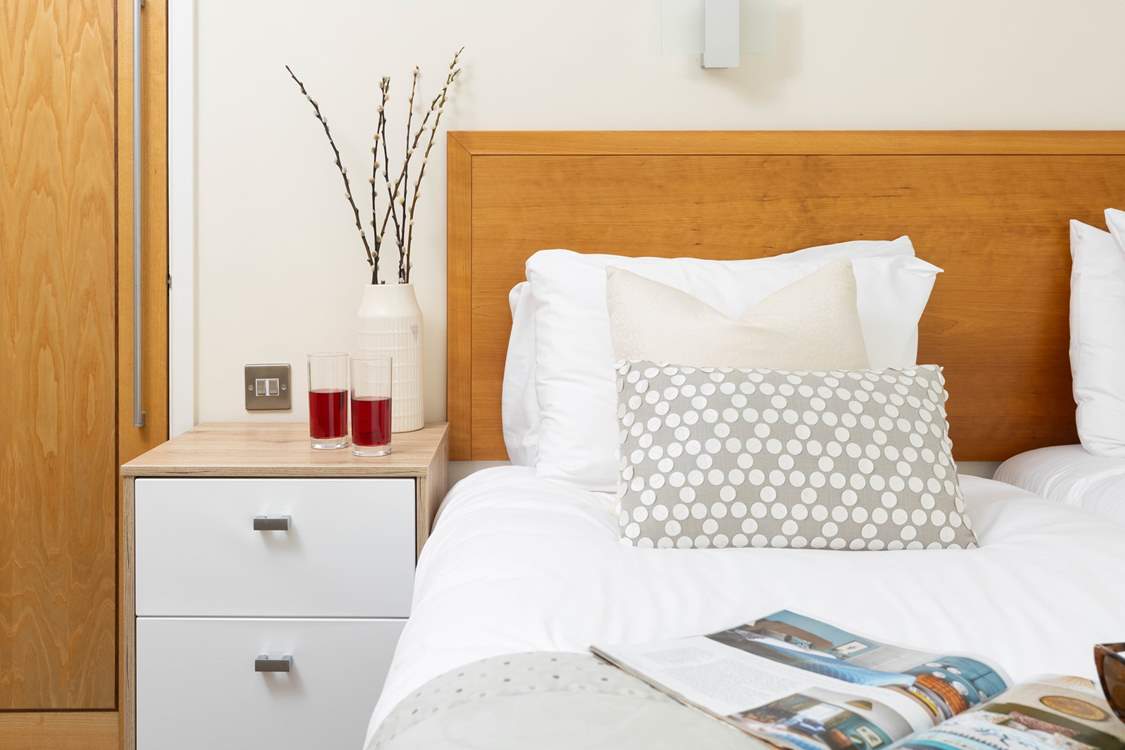 Relaxation can be found in the bedroom.