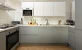 The stylish kitchen is fully equipped and ready for your arrival. - Thumbnail Image