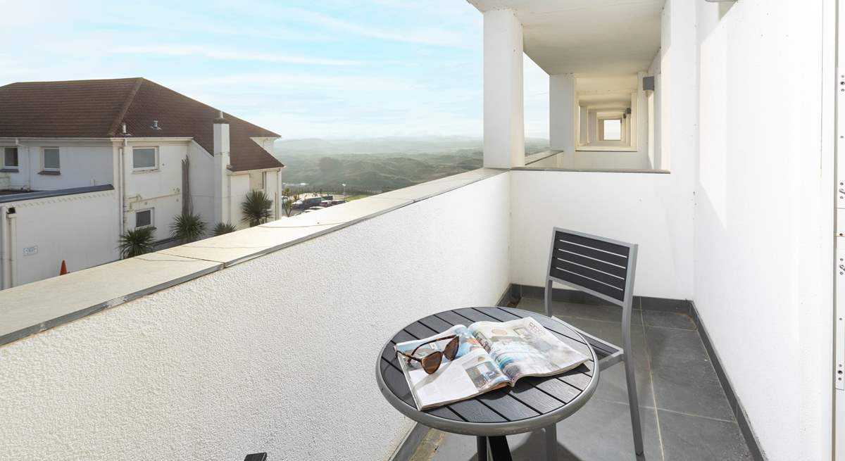 The apartment benefits from a balcony with glimpses of the sand dunes.